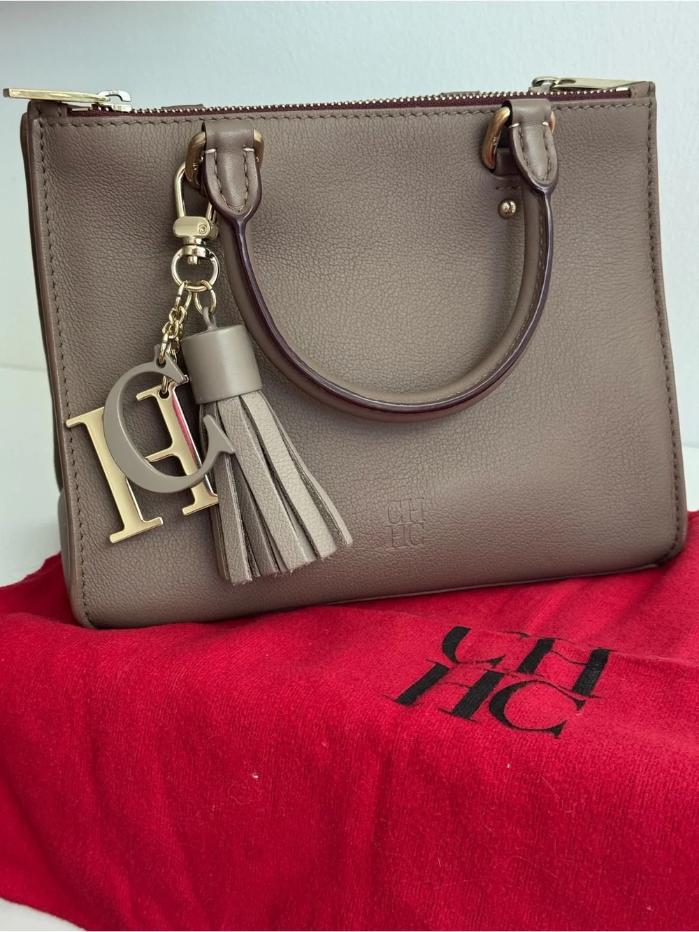 Carolina Herrera Elegant Brown Leather Top-Handle Handbag with Tassel Charm